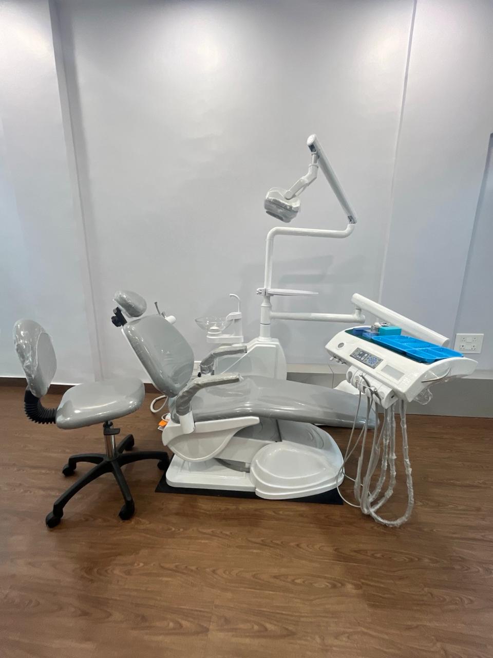 A dental chair and operating light at Evara Dental Clinic, ready for the next patient