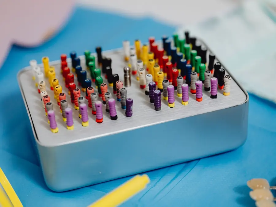 Colour-coded endodontic files arranged in a sterilisation box